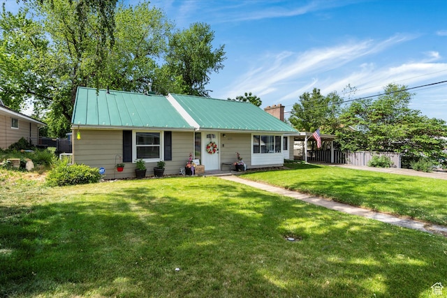 1225 E 5th St, Ogden, UT 84404 - view of front of property featuring a chimney, metal roof, and a standing seam roof