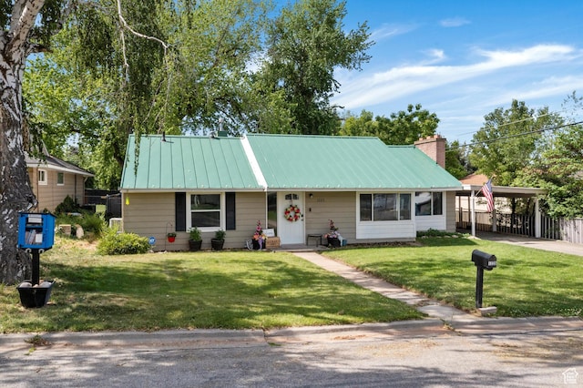 1225 E 5th St, Ogden, UT 84404 - view of front of house with a detached carport, metal roof, concrete driveway, a chimney, and a standing seam roof