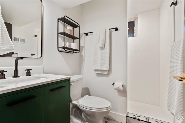 785 E Tenth Ave N, Salt Lake City, UT 84103 - bathroom featuring vanity, toilet, a walk in shower, baseboards, and tile patterned floors