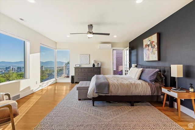 785 E Tenth Ave N, Salt Lake City, UT 84103 - bedroom featuring a wall mounted air conditioner, a mountain view, recessed lighting, wood finished floors, and a ceiling fan