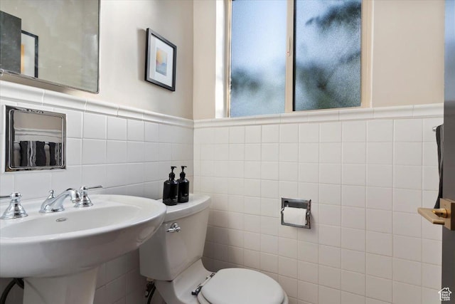 785 E Tenth Ave N, Salt Lake City, UT 84103 - half bath featuring tile walls, toilet, and a sink