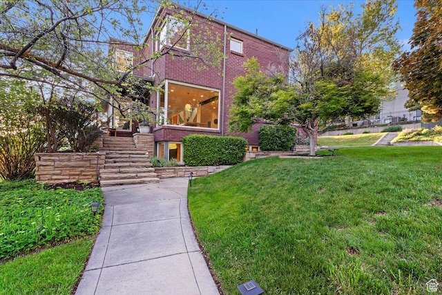 785 E Tenth Ave N, Salt Lake City, UT 84103 - view of side of home with stairs, a yard, and brick siding