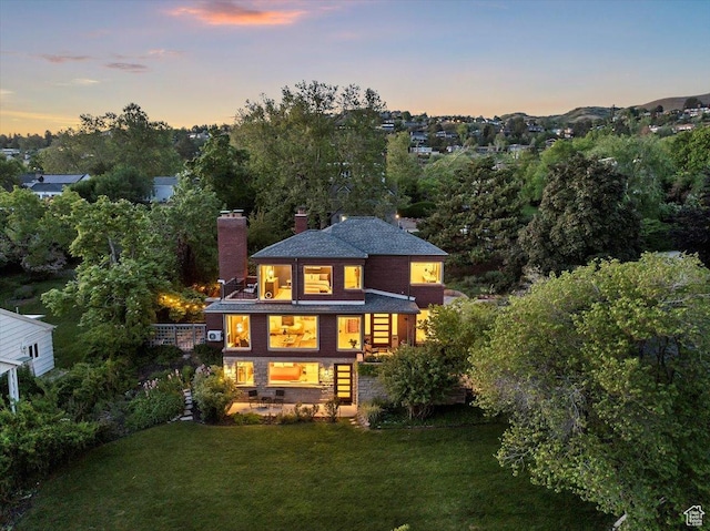 785 E Tenth Ave N, Salt Lake City, UT 84103 - back of property with a chimney and a yard