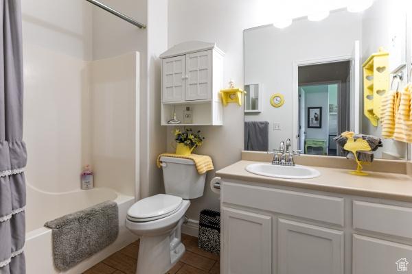 4732 W Wagon Train Dr, Herriman, UT 84096 - full bath featuring vanity, toilet, and shower / tub combo with curtain