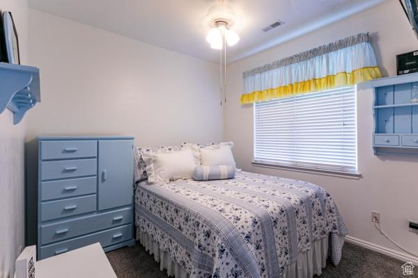 4732 W Wagon Train Dr, Herriman, UT 84096 - bedroom with dark colored carpet and baseboards