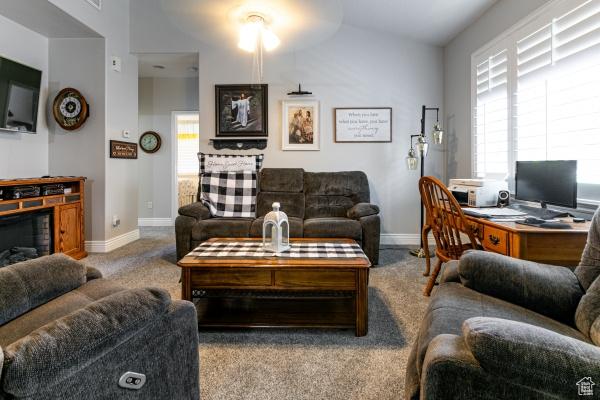 4732 W Wagon Train Dr, Herriman, UT 84096 - living room featuring baseboards, plenty of natural light, and carpet floors