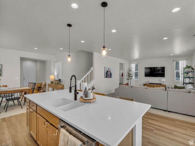 6352 N Canter Dr, Stansbury Park, UT 84074 - kitchen with a sink, dishwasher, light wood-style floors, light countertops, and recessed lighting