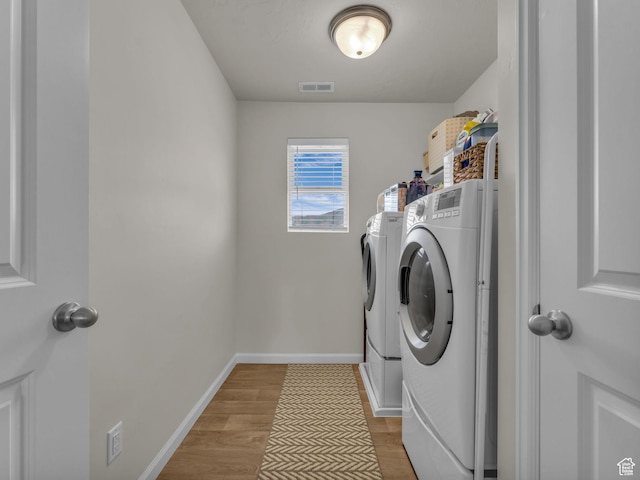 6352 N Canter Dr, Stansbury Park, UT 84074 - washroom featuring independent washer and dryer, light wood finished floors, and baseboards