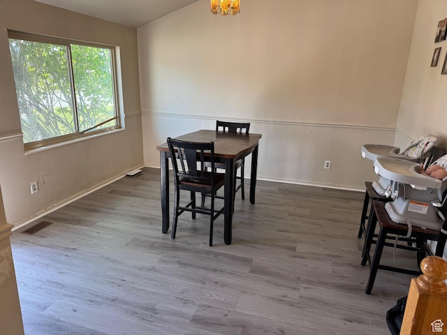 39 S 1300 W, Clearfield, UT 84015 - dining area with wood finished floors, a chandelier, and baseboards