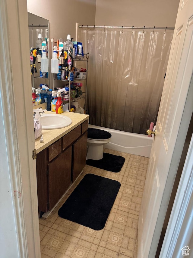 39 S 1300 W, Clearfield, UT 84015 - bathroom featuring vanity, toilet, shower / tub combo with curtain, and tile patterned flooring