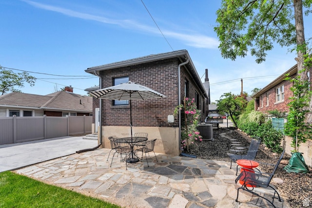 1440 E 1300 S, Salt Lake City, UT 84105 - back of property with brick siding and a patio area