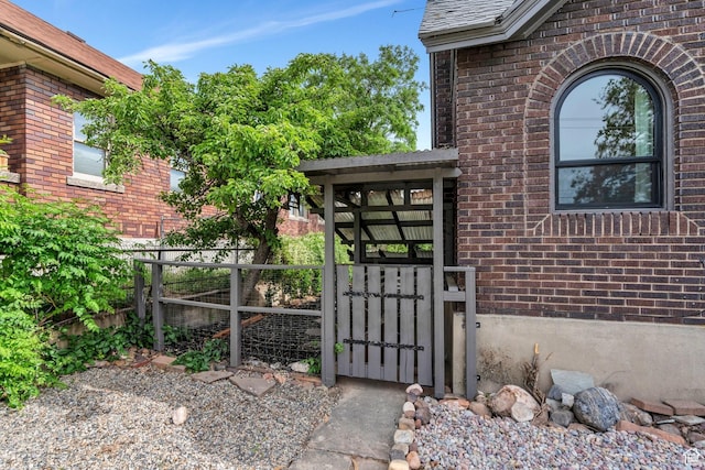 1440 E 1300 S, Salt Lake City, UT 84105 - view of exterior entry with a gate and brick siding