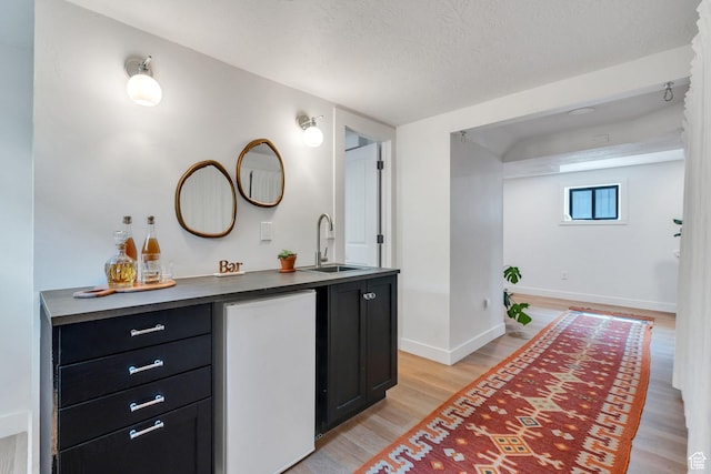 1440 E 1300 S, Salt Lake City, UT 84105 - bathroom featuring wood finished floors, vanity, baseboards, and a textured ceiling