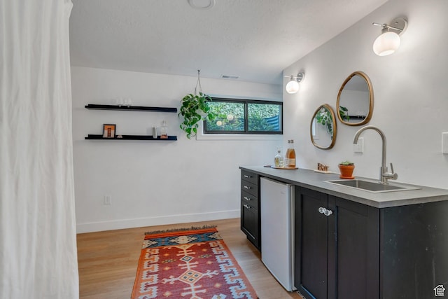 1440 E 1300 S, Salt Lake City, UT 84105 - bathroom with vanity, wood finished floors, baseboards, and a textured ceiling