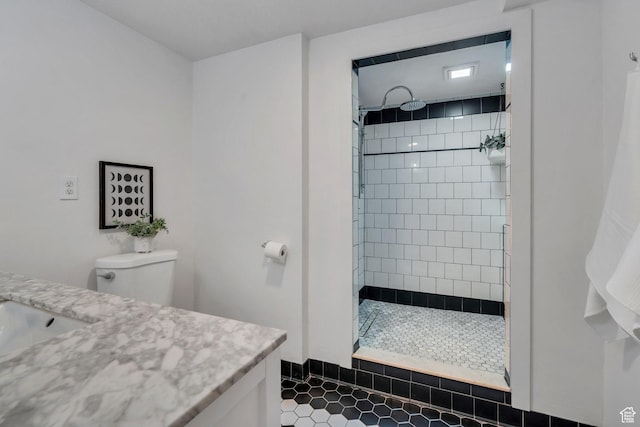 1440 E 1300 S, Salt Lake City, UT 84105 - full bathroom featuring vanity, tiled shower, tile patterned floors, and toilet