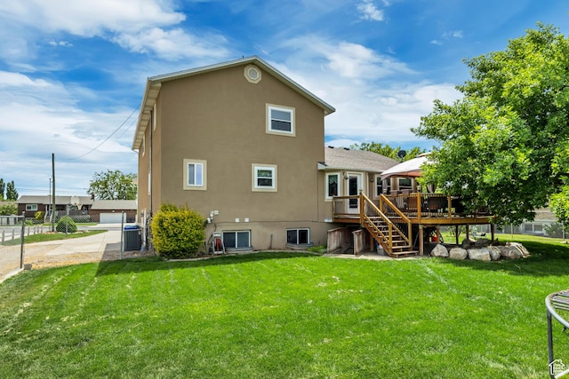 1254 W 2700 S, Syracuse, UT 84075 - rear view of property featuring stucco siding, stairs, a deck, a lawn, and central AC unit