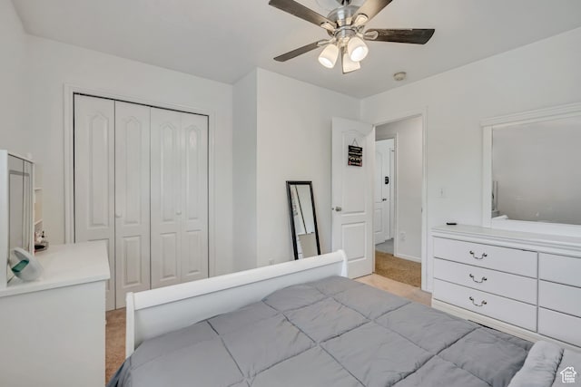 1254 W 2700 S, Syracuse, UT 84075 - bedroom featuring light colored carpet, a closet, a ceiling fan, and baseboards
