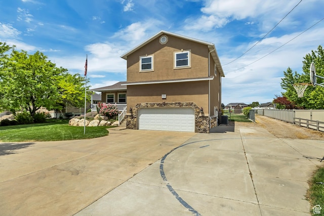 1254 W 2700 S, Syracuse, UT 84075 - traditional-style house featuring concrete driveway, stucco siding, an attached garage, and stone siding