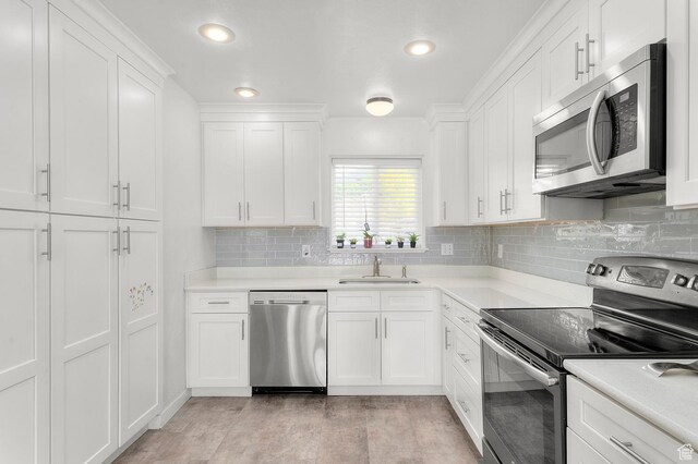 2091 N 180 E, Provo, UT 84604 - kitchen with stainless steel appliances, white cabinetry, light countertops, backsplash, and recessed lighting