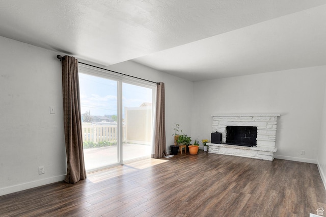 2091 N 180 E, Provo, UT 84604 - unfurnished living room with dark wood-type flooring and a stone fireplace