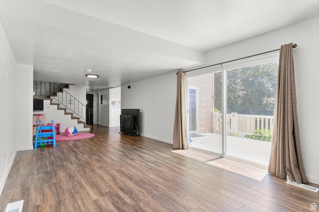 2091 N 180 E, Provo, UT 84604 - unfurnished living room featuring wood finished floors and stairs