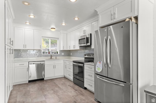2091 N 180 E, Provo, UT 84604 - kitchen with appliances with stainless steel finishes, white cabinetry, light countertops, tasteful backsplash, and recessed lighting