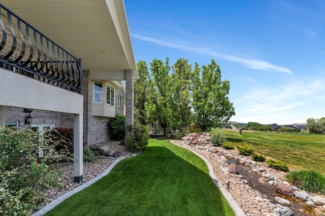 1736 S Range Rd, Saratoga Springs, UT 84045 - view of grassy yard featuring a balcony