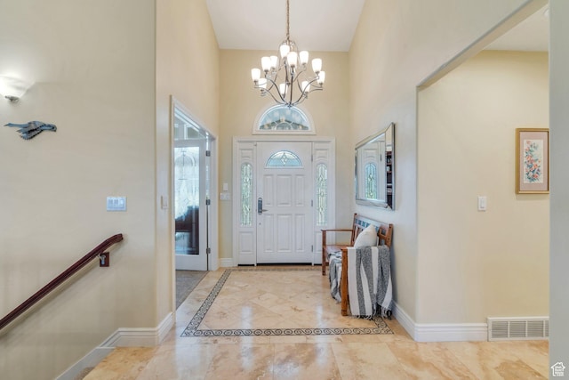 1736 S Range Rd, Saratoga Springs, UT 84045 - foyer entrance featuring a chandelier, plenty of natural light, baseboards, and a high ceiling