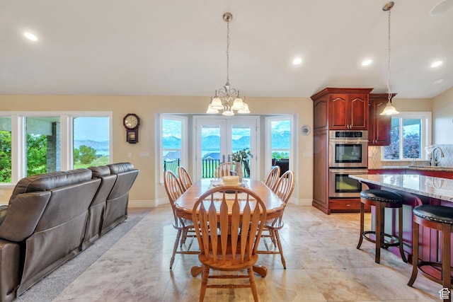 1736 S Range Rd, Saratoga Springs, UT 84045 - dining area with a chandelier, baseboards, and recessed lighting