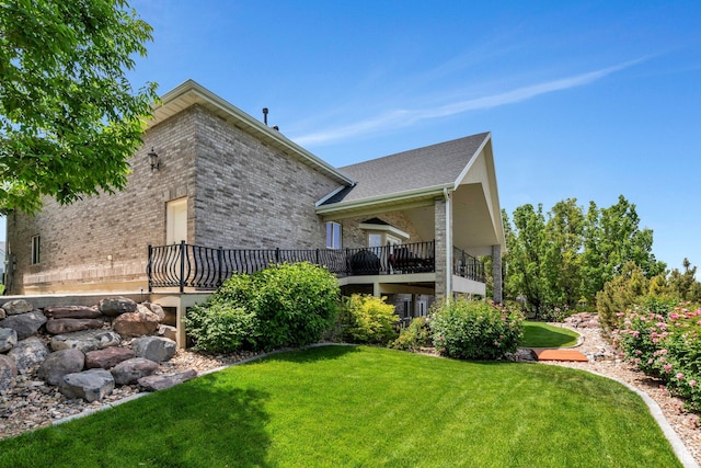 1736 S Range Rd, Saratoga Springs, UT 84045 - back of property featuring brick siding and a lawn