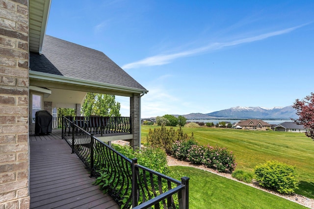 1736 S Range Rd, Saratoga Springs, UT 84045 - wooden terrace with a mountain view and a lawn