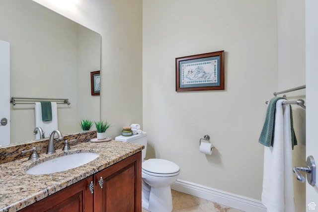 1736 S Range Rd, Saratoga Springs, UT 84045 - bathroom with baseboards, vanity, toilet, and tile patterned flooring