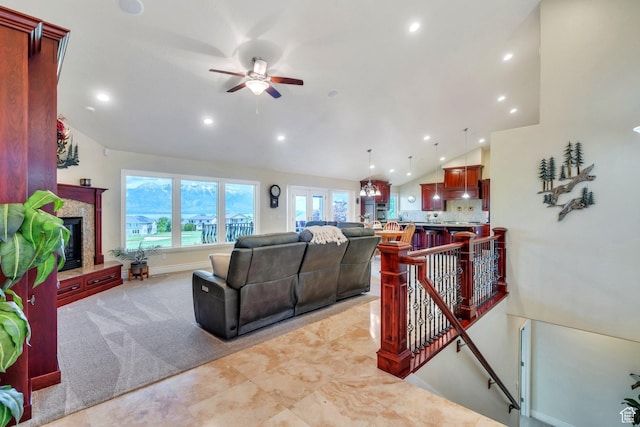 1736 S Range Rd, Saratoga Springs, UT 84045 - living area with vaulted ceiling, a high end fireplace, recessed lighting, and ceiling fan