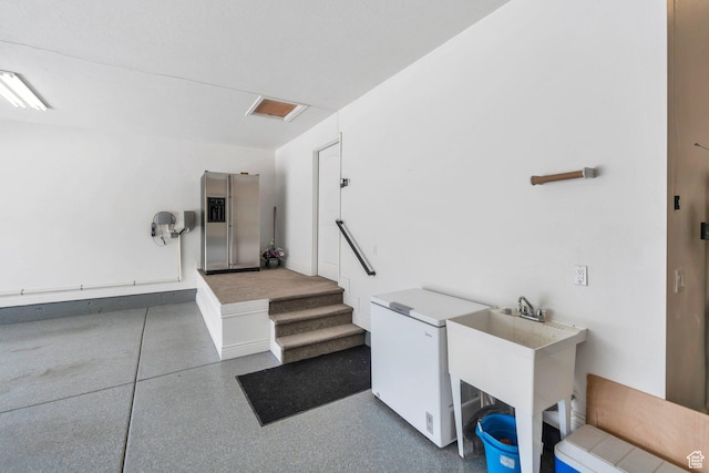 1736 S Range Rd, Saratoga Springs, UT 84045 - garage featuring stainless steel fridge with ice dispenser and white fridge