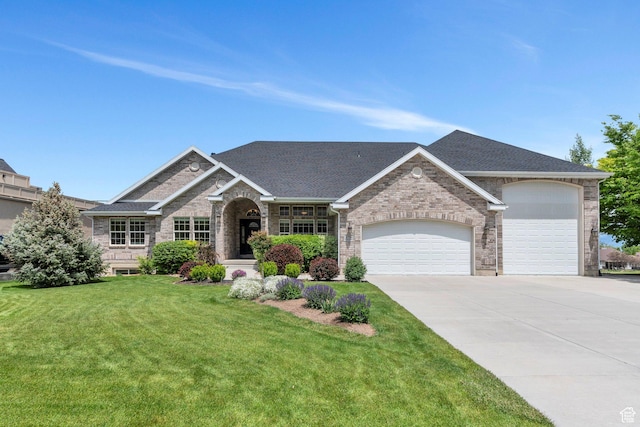 1736 S Range Rd, Saratoga Springs, UT 84045 - view of front of home with an attached garage, driveway, brick siding, and roof with shingles