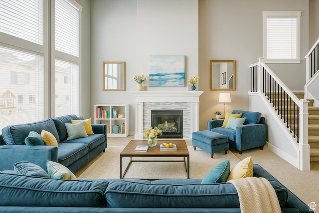 13211 S Weatherford Ln W, Herriman, UT 84096 - living room with carpet, a towering ceiling, healthy amount of natural light, stairway, and baseboards