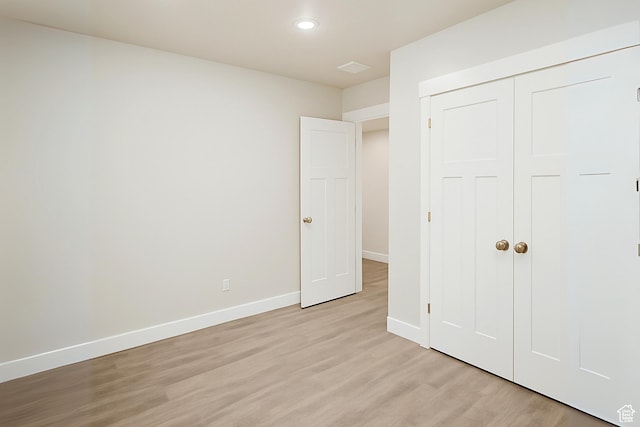 13211 S Weatherford Ln W, Herriman, UT 84096 - unfurnished bedroom with light wood-type flooring, baseboards, a closet, and recessed lighting