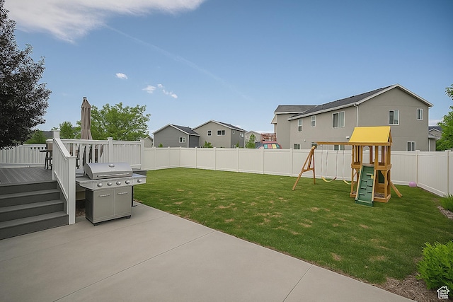 13211 S Weatherford Ln W, Herriman, UT 84096 - view of yard with a patio, a playground, a residential view, and a wooden deck