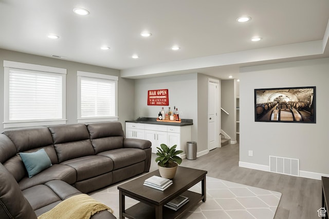 13211 S Weatherford Ln W, Herriman, UT 84096 - living room featuring a dry bar, stairs, recessed lighting, light wood-style floors, and baseboards