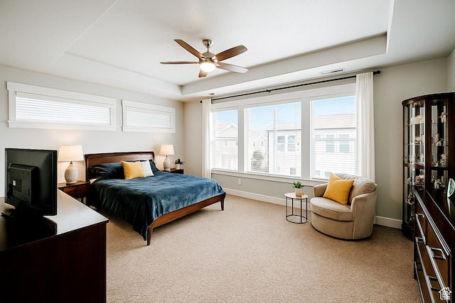 13211 S Weatherford Ln W, Herriman, UT 84096 - bedroom featuring a raised ceiling, baseboards, light colored carpet, and a ceiling fan