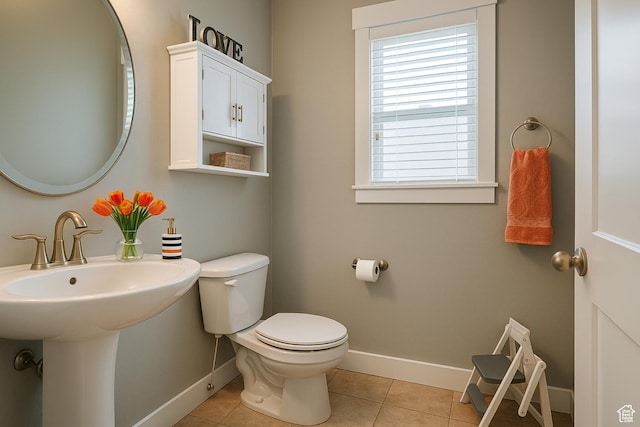 13211 S Weatherford Ln W, Herriman, UT 84096 - bathroom with baseboards, toilet, and tile patterned flooring