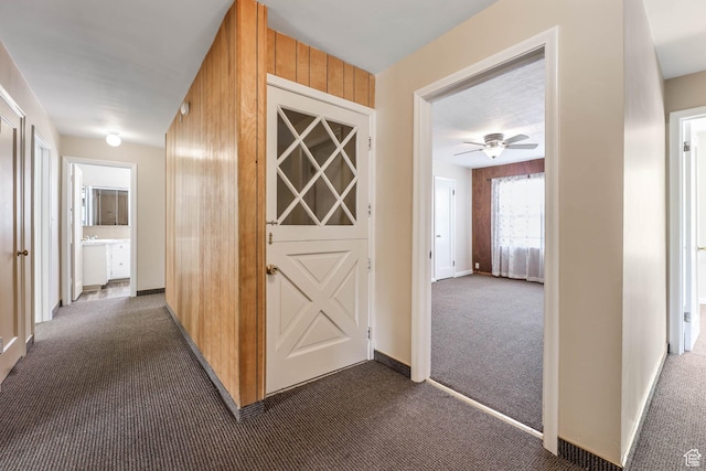 810 Canyon Rd, Ogden, UT 84404 - hall with dark colored carpet and baseboards