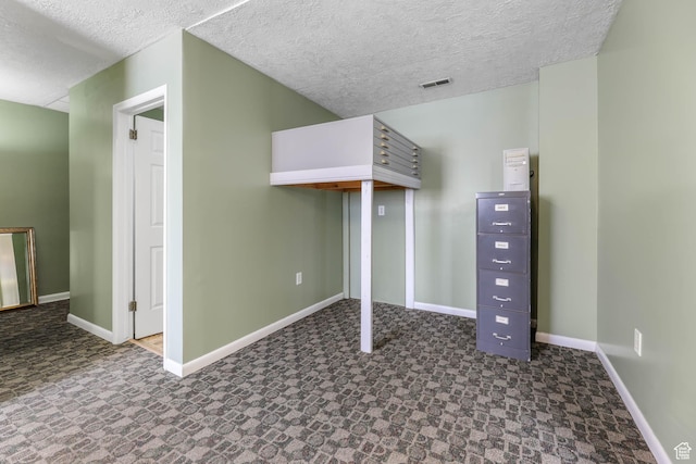 810 Canyon Rd, Ogden, UT 84404 - additional living space with baseboards, a textured ceiling, and tile patterned floors
