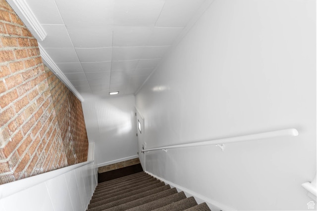810 Canyon Rd, Ogden, UT 84404 - stairway featuring brick wall and carpet flooring