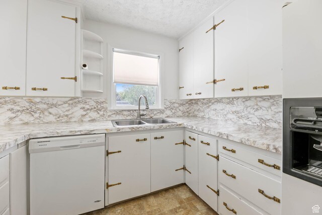 810 Canyon Rd, Ogden, UT 84404 - kitchen with dishwasher, a sink, backsplash, a textured ceiling, and light countertops