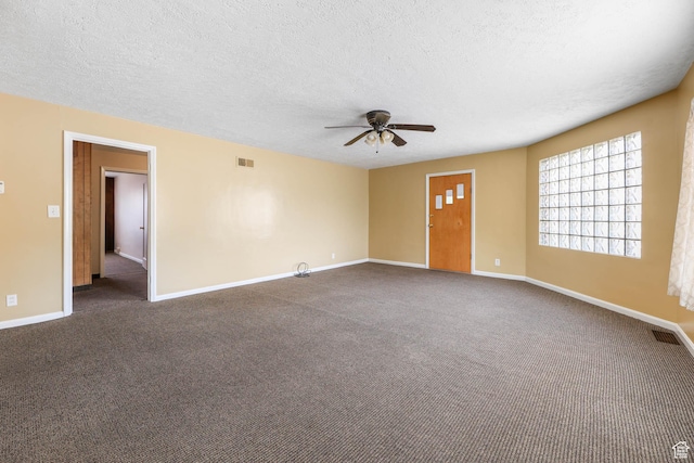 810 Canyon Rd, Ogden, UT 84404 - unfurnished room with ceiling fan, a textured ceiling, dark carpet, and baseboards