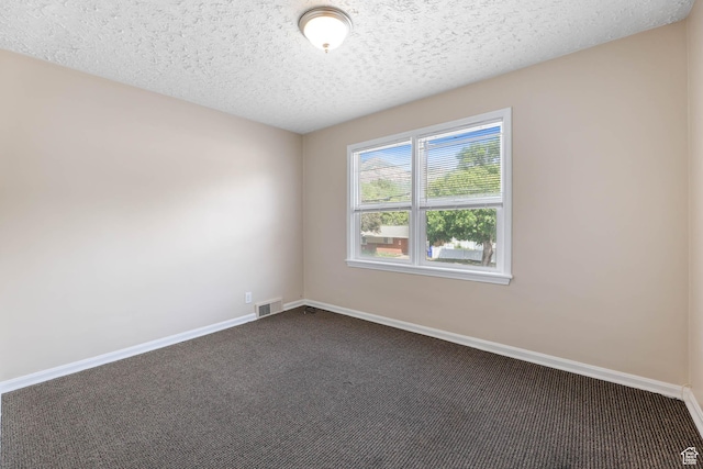 810 Canyon Rd, Ogden, UT 84404 - unfurnished room with dark carpet, baseboards, and a textured ceiling