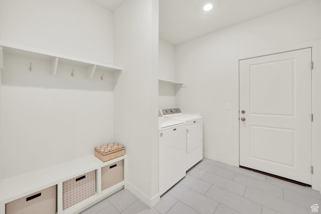 7405 W Glowing Sky Dr S, West Valley City, UT 84081 - laundry room featuring washing machine and dryer, baseboards, and light tile patterned floors