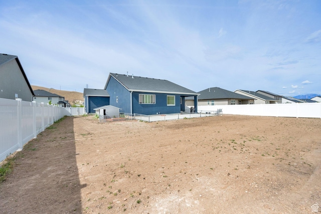 7405 W Glowing Sky Dr S, West Valley City, UT 84081 - rear view of property featuring a fenced backyard