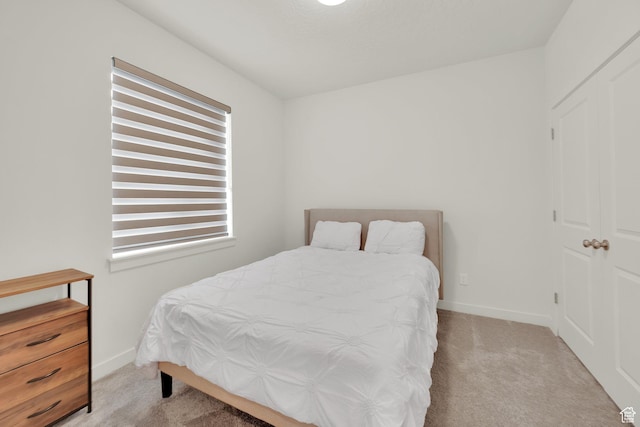 7405 W Glowing Sky Dr S, West Valley City, UT 84081 - bedroom featuring carpet and baseboards
